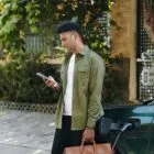 Man Checking Notifications on Smartphone