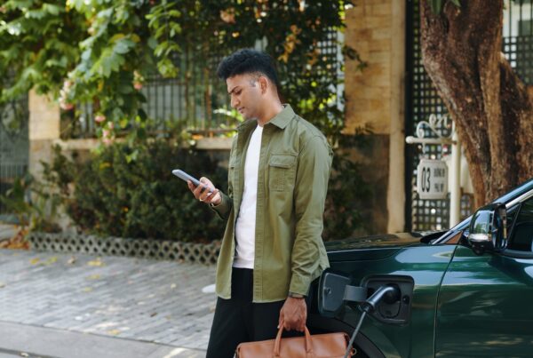 Man Checking Notifications on Smartphone
